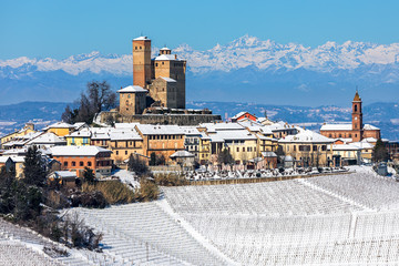 Small medieval town on snowy hill in Italy. - obrazy, fototapety, plakaty