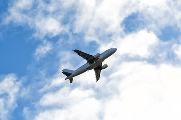 Fototapeta na wymiar Passenger airliner flight in the blue sky. Travel concept.