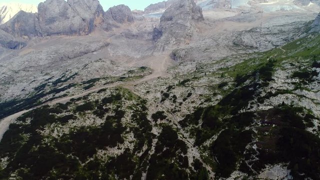 Aerial view of the north side of the Marmolada glacier in summer, top of italian dolomites. Massif glacier. Evidence of global warming and melting glaciers