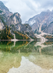 Foggy autumn morning at Lake Braies, Province of Bolzano, Trentino Alto Adige, Italy.