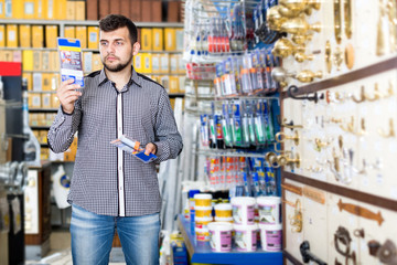 Man deciding on best glue