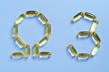 Fish oil capsules in shape Omega 3