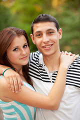 Portrait happy young teenage couple outdoor