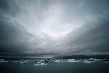 Obraz na płótnie Canvas Fragments of iceberg in sea water. Iceland north sea