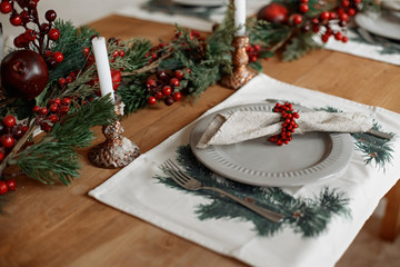 Beautiful festive table setting for Christmas dinner at home