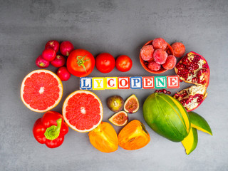 Fruits and vegetables containing lycopene. Healthy vegan food background. Lycopene is a red...