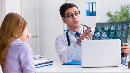 The doctor examining x-ray images of patient
