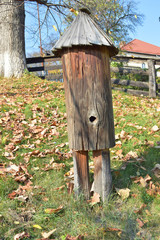 Old wooden bee hive made from tree trunk, Village, Country