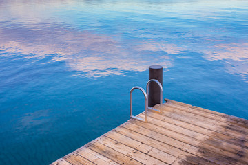 Swimming dock on a lake at sunset