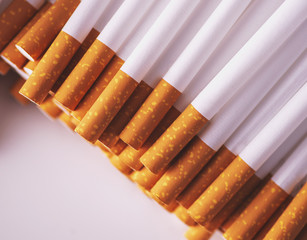 Close up of a smoking cigarettes . cigarette filter tubes