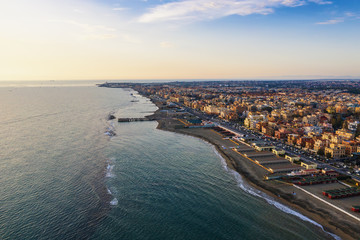 Aerial view of Ostia beach near Rome, Italy. Beautiful sea, coast and city view from above, drone...