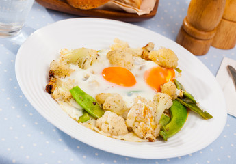 Appetizing cauliflower fried eggs for breakfast