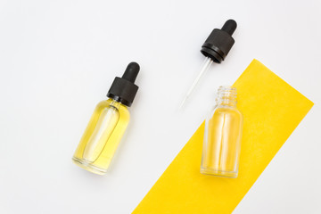 Bottle with dropper on white background.