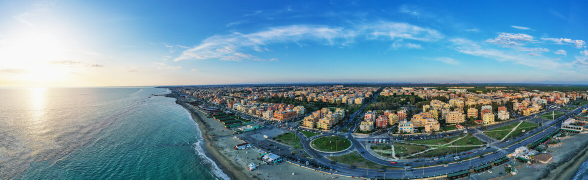 Ostia beach aerial view from drone. Ostia Lido near Rome, Italy. Beautiful sea, coast and city view at sunset from above.
