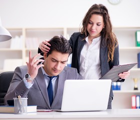Sexual harassment concept with man and woman in office
