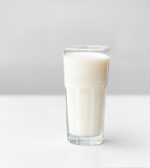Glass of milk on a white marble table