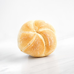 Close-up view of a single whole bread roll
