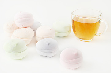 Air marshmallows in pastel shades. A gentle marshmallows. A gentle zephyr on a white background. Marshmallows in a light key. Marshmallows with tea.