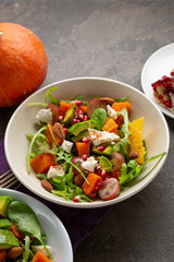 Winter salad with pumpkin in bowl