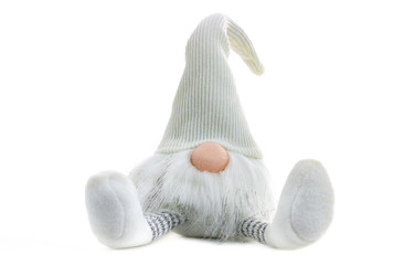 Gnome a Christmas elf is relaxed and sitting on white background with open legs