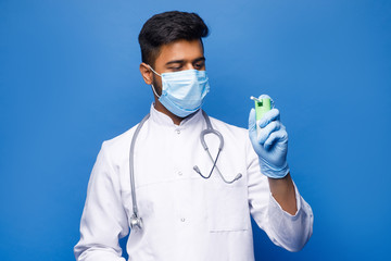 Medical laboratory. Selective focus of blood sample being held by a nice handsome male scientist while sitting in the blue background.