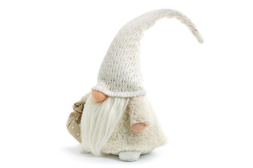 Gnome a beautiful christmas elf in thick warm coat with gift bag standing on white background