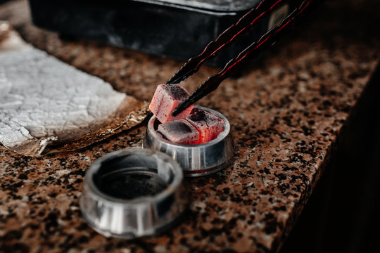 Hookah fan inflates the coals for a hookah - Powered by Adobe