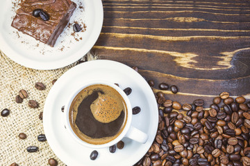 Cup of black coffee and cake