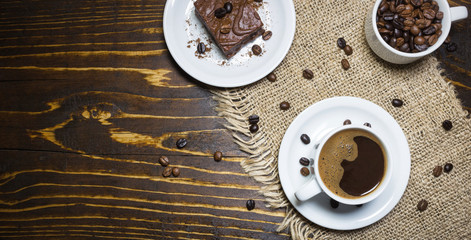 Cup of black coffee and cake