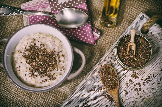 Oatmeal porridge bowl with flax linen seeds