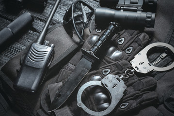 Special agent table with combat equipment abstract background.