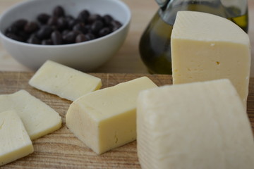 Typical cow cheese from Spain on a wooden board