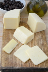 Typical cow cheese from Spain on a wooden board