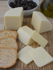 Typical cow cheese from Spain on a wooden board