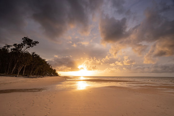 Obraz na płótnie Canvas Australia Fraser Island K'gari sunset after storm on beach