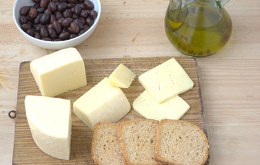 Typical cow cheese from Spain on a wooden board