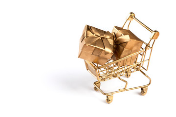 Shopping cart trolley basket gold color with gifts.