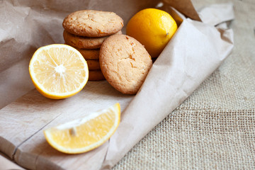 lemon cookies made at home, citrus baking deliciously lies on a table in a paper wrapper, a recipe for fruit baking