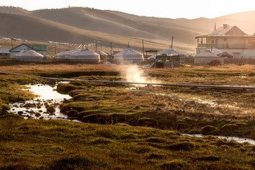 Tsenher Hot Springs in Mongolia, with steam coming out from the very soil.