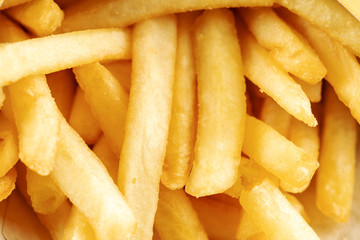 a pile of potato fries close up. background backdrop macro photo.
