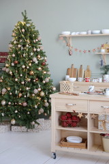 Christmas tree in the New Year decorated kitchen