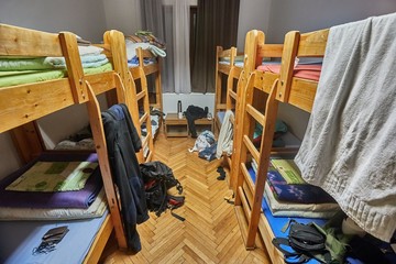 Backpacker dormitory room with some mess - obrazy, fototapety, plakaty