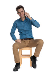 smart casual man smiling and talking on the phone