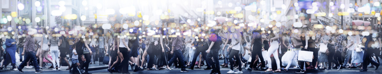 Lots of people walking in the City of London. Wide panoramic view of people crossing the road....