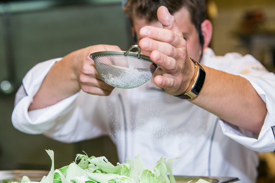 Close up hands of chef preparing sweet dezert. Cooking concept