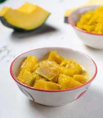 Desserts THAILAND made with pumpkins and coconut milk in bowl,on white backdrop