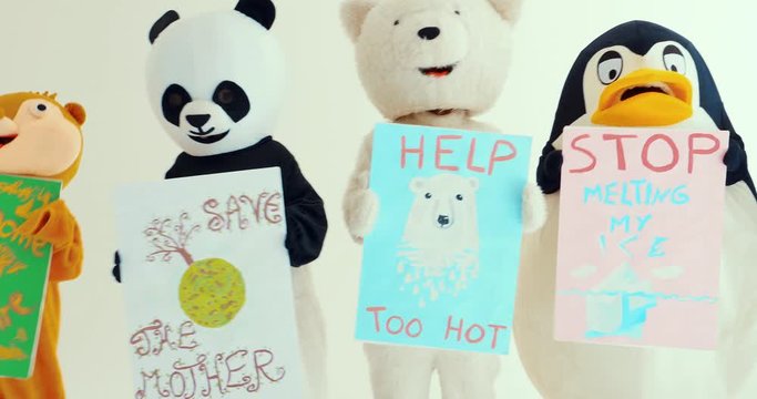 Polar bear and animal mascots characters with a message for humanity, about global warming and pollution problems on our planet