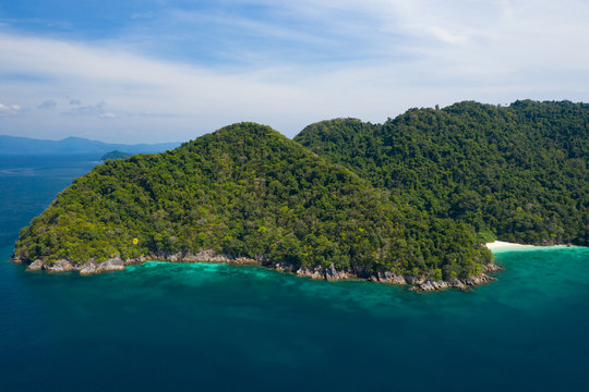 Aerial view from a drone of beautiful Nyaung Oo Phee island on sunny day in Myanmar. © bomboman