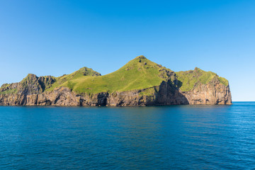 Fototapeta premium Cliffs of island of Heimaey in Vetmannaeyjar island group in Iceland