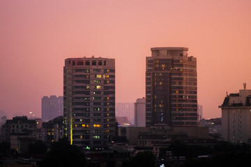 Fototapeta na wymiar Hanoi city Skyline and cityscape captured during a beautiful Vietnamese sunset in October of 2019 from a skybar.